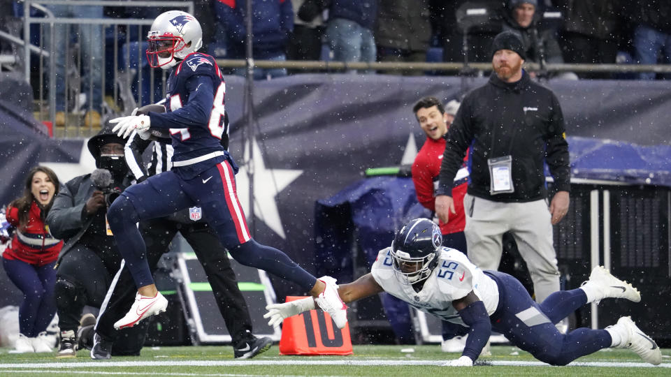 New England Patriots wide receiver Kendrick Bourne, left, out runs Tennessee Titans inside linebacker Jayon Brown (55) on his touchdown during the second half of an NFL football game against the Tennessee Titans, Sunday, Nov. 28, 2021, in Foxborough, Mass. (AP Photo/Steven Senne)