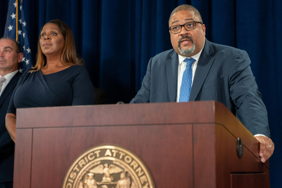 NEW YORK, NEW YORK - SEPTEMBER 08: New York State Attorney General Letitia James (L) looks on as Manhattan District Attorney Alvin Bragg speaks at a press conference after Steve Bannon, former advisor to former President Donald Trump surrendered at the NY District Attorney's office to face charges on September 08, 2022 in New York City. Bannon faces a new criminal indictment that will mirror the federal case in which he was pardoned by former President Donald Trump. He and others have been alleged to have defrauded contributors to a private $25 million fundraising effort to build a wall along the U.S.-Mexico border according. (Photo by David Dee Delgado/Getty Images)