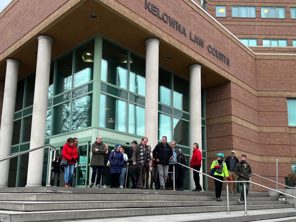 David Lindsay leaves the Kelowna, B.C., courthouse with his supporters following the first day of his trial on Wednesday, March 1, 2023