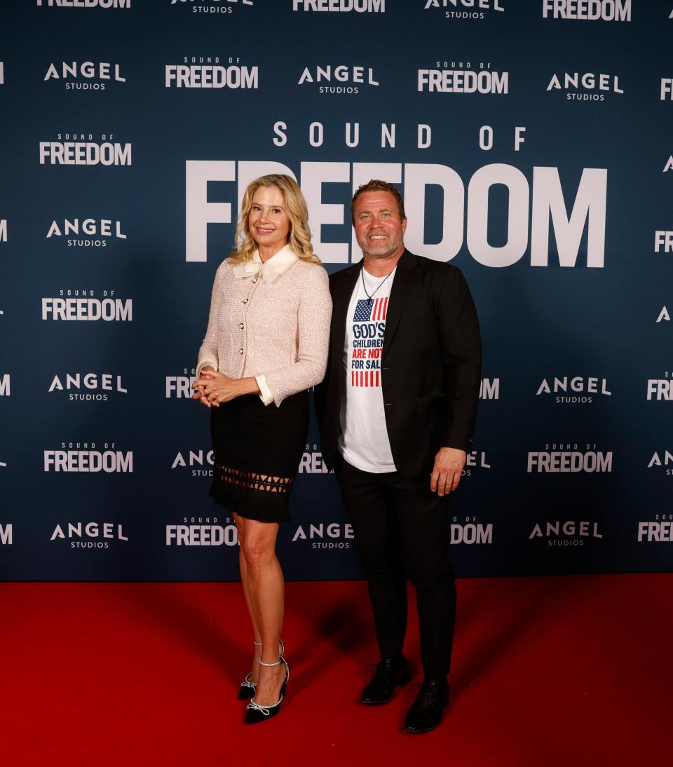 Mira Sorvino and Tim Ballard attend the premiere of "Sound of Freedom" on June 28, 2023, in Vineyard, Utah. The movie is based on Ballard's fight to rescue children from sexual slavery during his days as a Homeland Security agent.