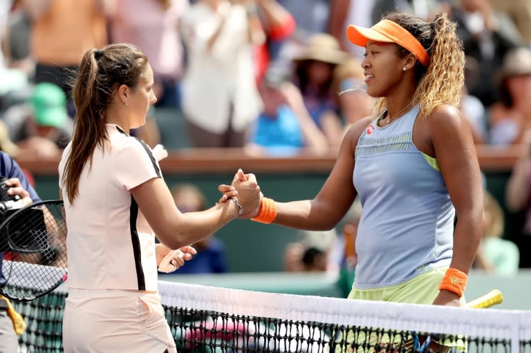 Daria Kasatkina of Russia congratulates Naomi Osaka of Japan after their match