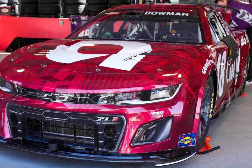 Apr 6, 2024; Martinsville, Virginia, USA; The car of NASCAR Cup Series driver Alex Bowman (48) painted in burgundy to honor the 40th Anniversary of Hendrick Motorsports before practice at Martinsville Speedway. Mandatory Credit: Jim Dedmon-USA TODAY Sports