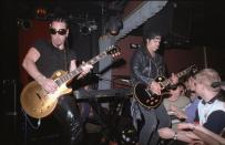 <p>Slash and Danny Saber play guitar at the Viper Room for the Jim Dunlop party in Los Angeles, California in 1999.</p>