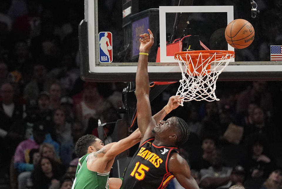 Boston Celtics forward Jayson Tatum (0) has his shot blocked by Atlanta Hawks center Clint Capela (15) during the first half of an NBA basketball game Thursday, March 28, 2024, in Atlanta. (AP Photo/John Bazemore)