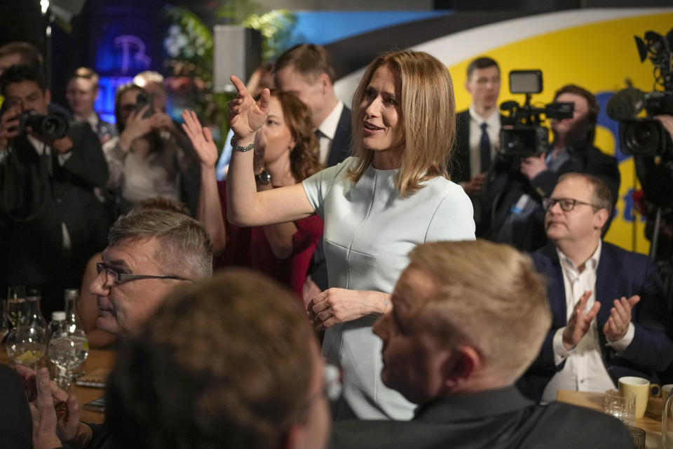 Prime Minister Kaja Kallas, centre, reacts to the announcement of preliminary results of the election in Tallinn, Estonia, Sunday, March 5, 2023. Voters in Estonia cast ballots Sunday in a parliamentary election where initial results suggested the center-right Reform Party of Prime Minister Kallas. one of Europe's most outspoken supporters of Ukraine, was on its way to a landslide victory. (AP Photo/Sergei Grits)