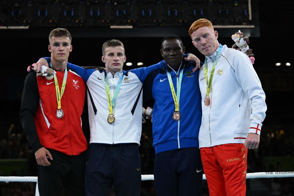 Silver medalist Wales' Taylor Bevan (L), Gold medalist Scotland's Sean Lazzerini (2L) and Bronze medalists Tanzania's Yusuf Lucasi Changalawe (2R) and England's Aaron Bowen  pose during the during the presentatino ceremony for the Mens Boxing Over 75kg-80kg (Light Heavyweight) on day ten of the Commonwealth Games at the NEC in  Birmingham, central England, on August 7, 2022. (Photo by Andy Buchanan / AFP) (Photo by ANDY BUCHANAN/AFP via Getty Images)