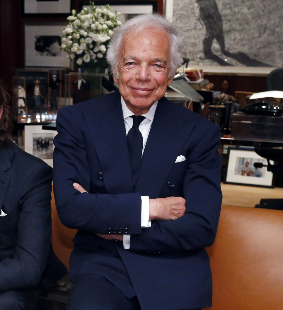 FILE - In this Sept. 29, 2015 file photo, designer Ralph Lauren poses in his office in New York. Lauren recently celebrated his label’s 50th birthday, and a new HBO documentary, "Very Ralph," marks the occasion with a profile of the man who is the closest thing that America has to a national designer. (AP Photo/Jason DeCrow, File)