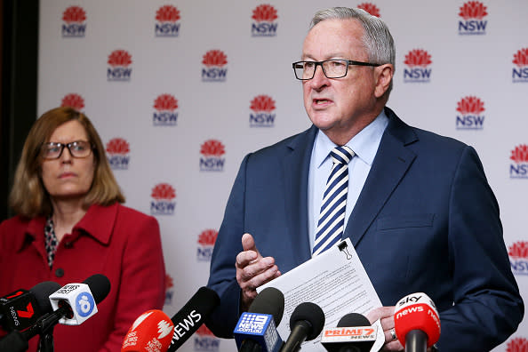 New South Wales Health Minister Brad Hazzard speaks as Chief Health Officer Dr Kerry Chant looks on. Source: Getty Images