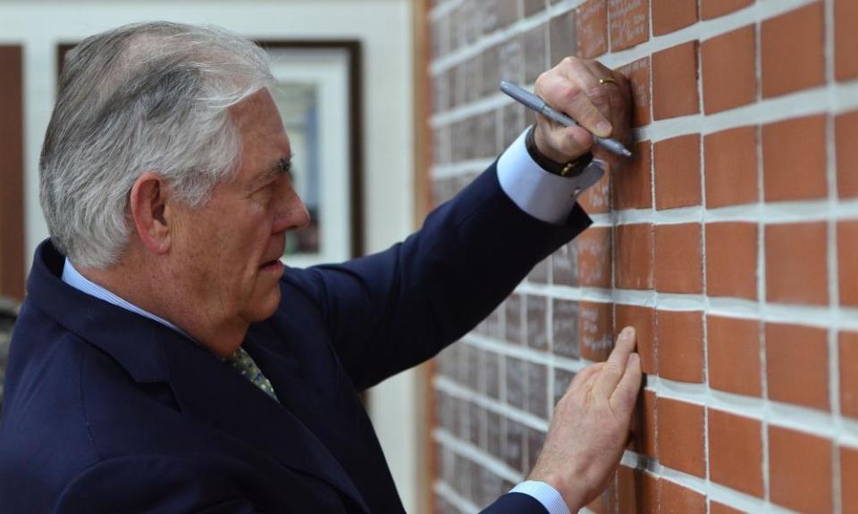 US Secretary of State Rex Tillerson signs a wall of the dining facility on Camp Bonifas during his South Korea visit.