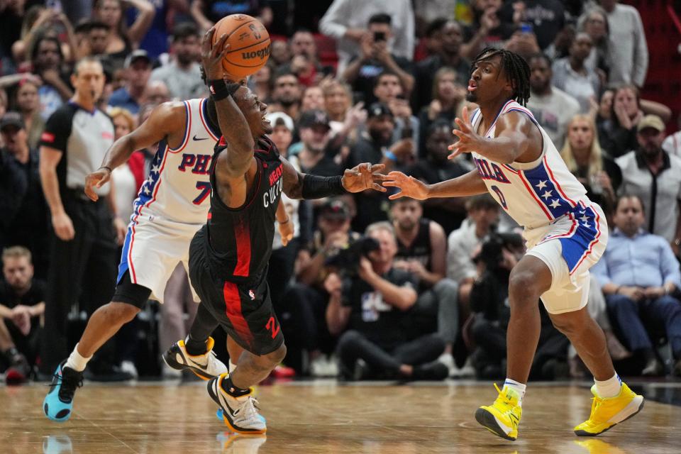 Apr 4, 2024; Miami, Florida, USA; Miami Heat guard Terry Rozier (2) throws the ball to a teammate as Philadelphia 76ers guard Kyle Lowry (7) and guard Tyrese Maxey (0) defend during the second half at Kaseya Center. Mandatory Credit: Jim Rassol-USA TODAY Sports