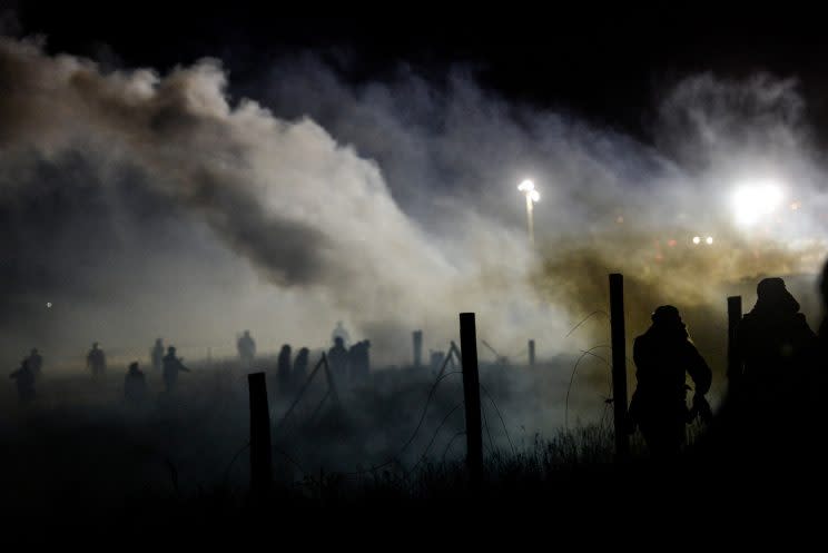 Police use tear gas to disperse protesters during a demonstration against the Dakota Access pipeline in Cannon Ball, N.D., on Sunday. (Stephanie Keith/Reuters)