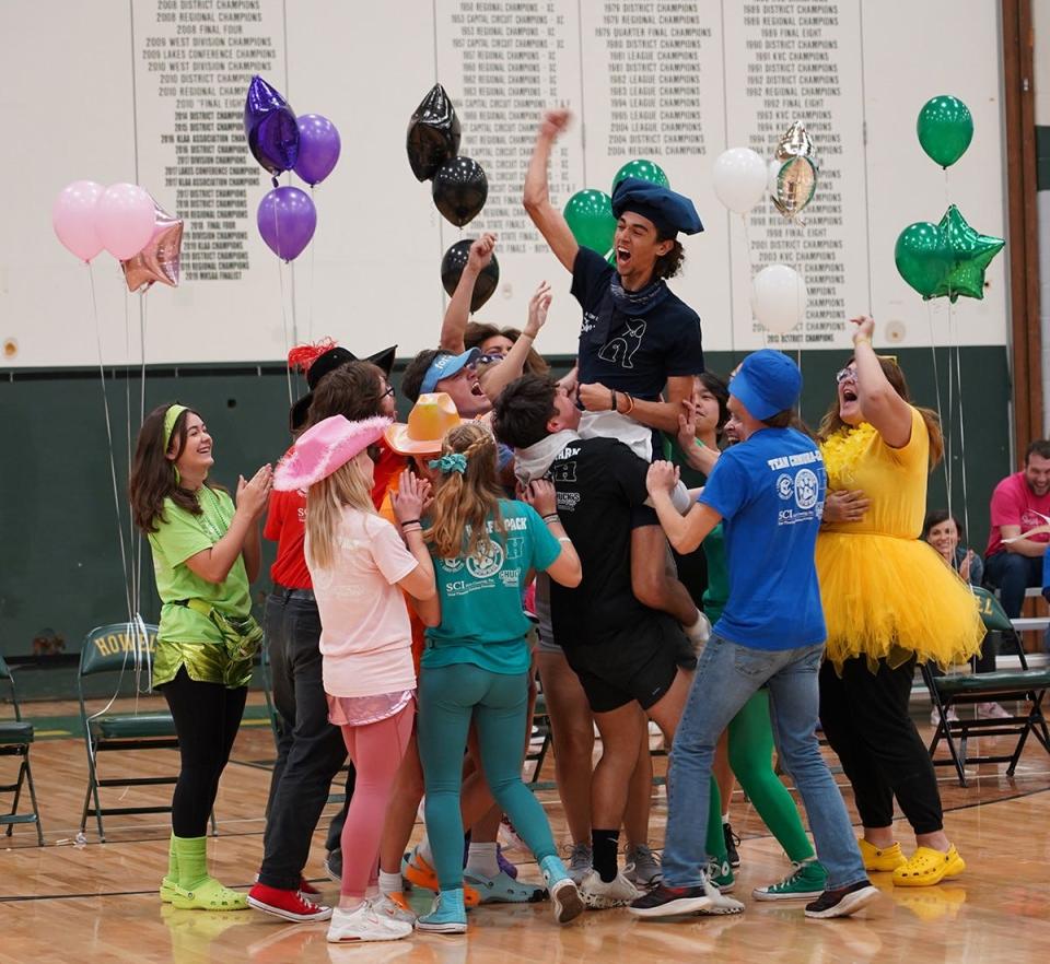 Participants celebrate a previous win through HPS' Senior Survivor Week.