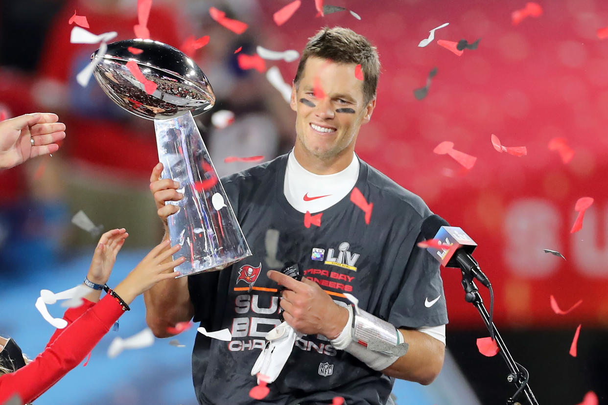 TAMPA, FL - FEBRUARY 07: Super Bowl MVP Tom Brady (12) of the Buccaneers holds the Lombardi Trophy after the Super Bowl LV game between the Kansas City Chiefs and the Tampa Bay Buccaneers on February 7, 2021 at Raymond James Stadium, in Tampa, FL. (Photo by Cliff Welch/Icon Sportswire via Getty Images)