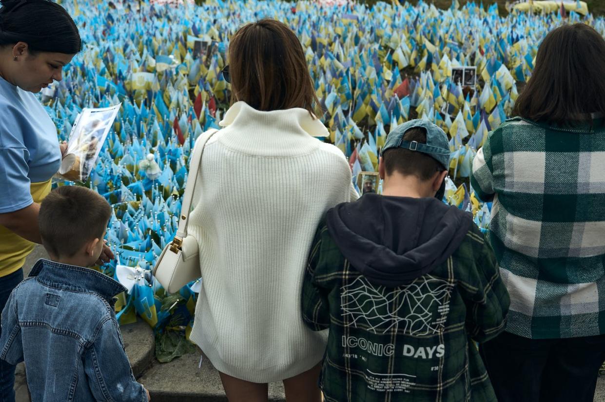 Ukrainians observe a minute of silence in Kyiv on Oct. 1, 2023. <a href="https://www.gettyimages.com/detail/news-photo/ukrainian-people-observe-a-minute-of-silence-on-the-day-of-news-photo/1700249608?adppopup=true" rel="nofollow noopener" target="_blank" data-ylk="slk:Libkos/Getty Images;elm:context_link;itc:0;sec:content-canvas" class="link ">Libkos/Getty Images</a>