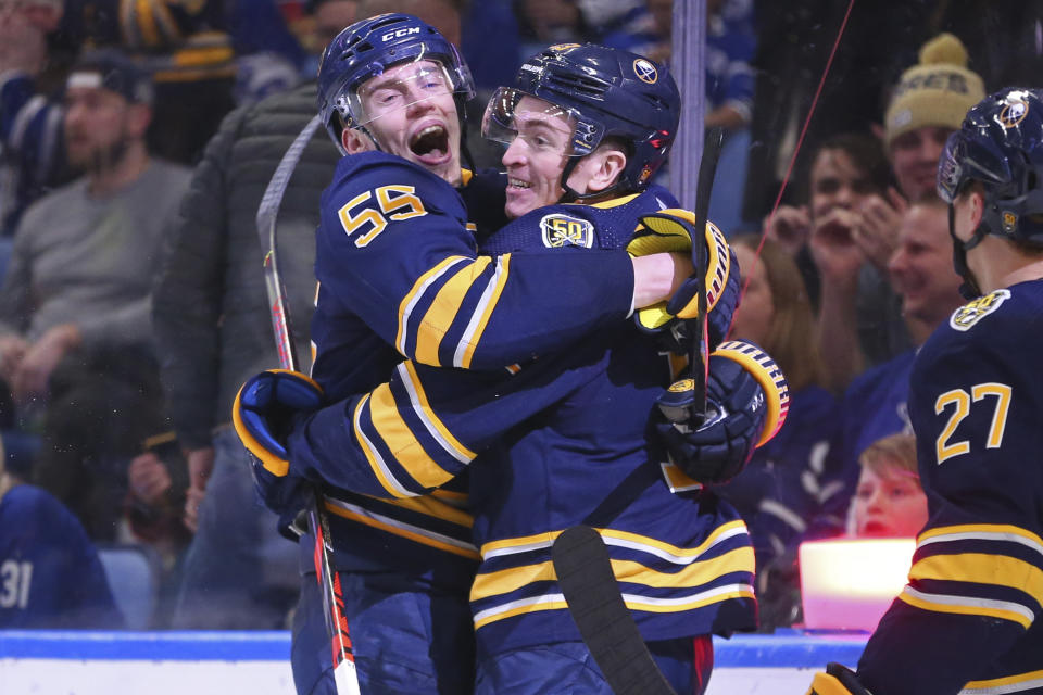 Buffalo Sabres forward Jimmy Vesey (13) celebrates his goal with defenseman Rasmus Ristolainen (55) during the third period of the team's NHL hockey game against Toronto Maple Leafs, Sunday, Feb. 16, 2020, in Buffalo, N.Y. (AP Photo/Jeffrey T. Barnes)