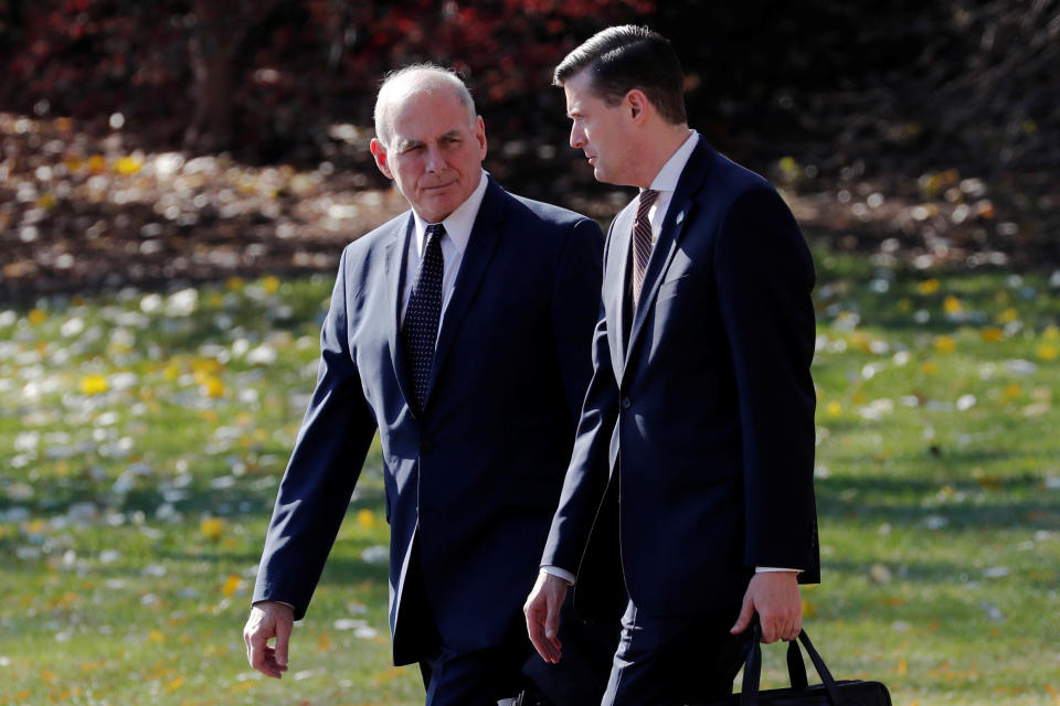 White House chief of staff John Kelly walks with Porter in Washington, D.C., last November. (Photo: Jonathan Ernst/Reuters)