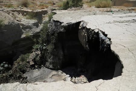 A mix of garbage and sewage is seen on the side of a sinkhole in the estuary of the Kidron Valley close to where it leads into the Dead Sea in the West Bank August 2, 2017. Picture taken August 2, 2017. REUTERS/Ammar Awad