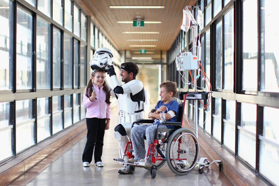 SYDNEY, AUSTRALIA - APRIL 11: Jacob French meets with patients Helena Kantarelis and Zak Brankstone at the Sydney Children's Hostpital on April 4, 2012 in Sydney, Australia. French today completed the over 5,000 km trek from Perth to Sydney on foot, donning a full body stormtrooper costume he successfully raised over $100,000 for the Starlight Children's Foundation. Since July 2011, Jacob has walked 10 hours a day, Monday to Friday, lost over 12kg in weight, and gone through seven pairs of shoes. The Starlight Children's Foundation provides programs to help lift the spirits of sick children in hospitals accross Australia. (Photo by Cameron Spencer/Getty Images)