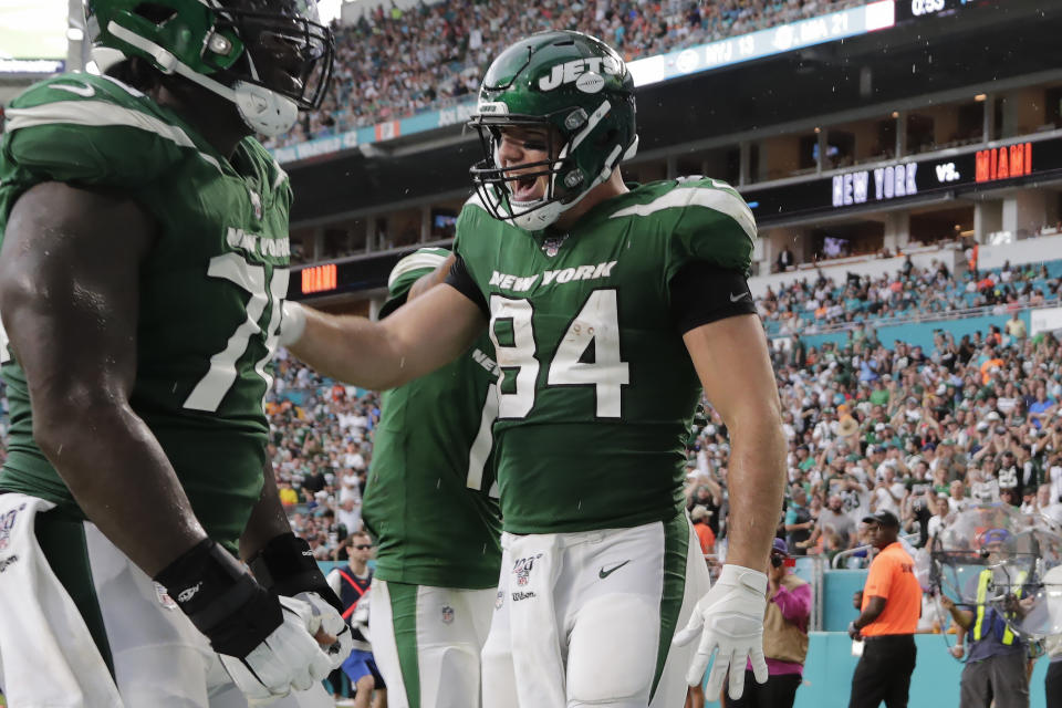 New York Jets tight end Ryan Griffin (84) celebrates after scoring a touchdown during the first half of an NFL football game against the Miami Dolphins, Sunday, Nov. 3, 2019, in Miami Gardens, Fla. The touchdown was later overturned upon review of the play. (AP Photo/Lynne Sladky)