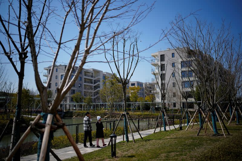 Elderly people walk at a nursing home of Lendlease's Ardor Gardens in Shanghai