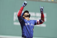 Toronto Blue Jays' Lourdes Gurriel Jr., celebrates his home run as he arrives at home plate in the first inning of a baseball game against the Boston Red Sox, Sunday, June 13, 2021, in Boston. (AP Photo/Steven Senne)