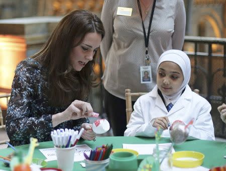 Britain's Catherine, Duchess of Cambridge makes a dinosaur egg whilst attending a children's tea party with pupils from Oakington Manor Primary School in Wembley, at the Natural History Museum in London, Britain November 22, 2016. REUTERS/Yui Mok/Pool