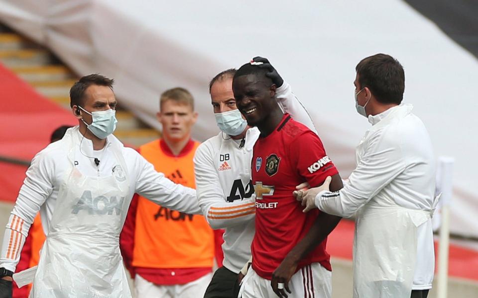 Eric Bailly of Manchester United receives treatment on an injury during the FA Cup Semi Final match between Manchester United and Chelsea at Wembley Stadium on July 19, 2020 in London, England. Football Stadiums around Europe remain empty due to the Coronavirus Pandemic as Government social distancing laws prohibit fans inside venues resulting in all fixtures being played behind closed doors - Matthew Peters /Manchester United 