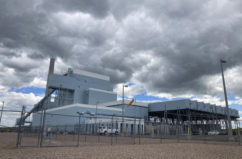 Basin Electric Power Cooperative’s Dry Fork Station coal-fired power plant, sits in outside Gillette, Wyo., on June 14, 2022. Geologists at the University of Wyoming are studying whether rock layers up to 10,000 feet deep can hold carbon dioxide emitted by the plant. (AP Photo/Mead Gruver)