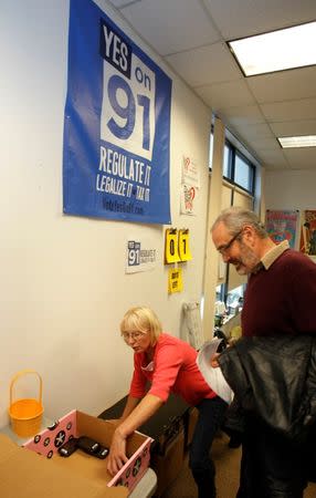 Lisa Kent (L) helps canvassers prepare to begin their routes to drum up support for Oregon's Measure 91, which would legalize the recreational use of marijuana in Portland, Oregon October 28, 2014. REUTERS/Steve Dipaola