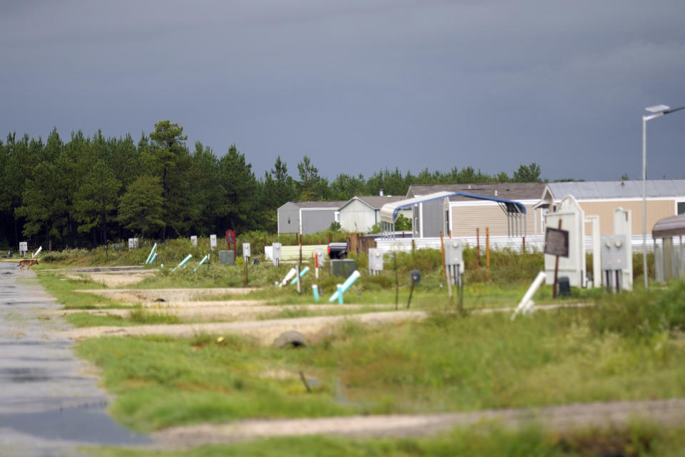 A row of mobile home is shown in the Colony Ridge development Tuesday, Oct. 3, 2023, in Cleveland, Texas. For weeks in Texas, conservative media and GOP activists have been pushing unsubstantiated claims that Colony Ridge has become a magnet for immigrants living in the U.S. illegally and that cartels control pockets of the neighborhood. (AP Photo/David J. Phillip)