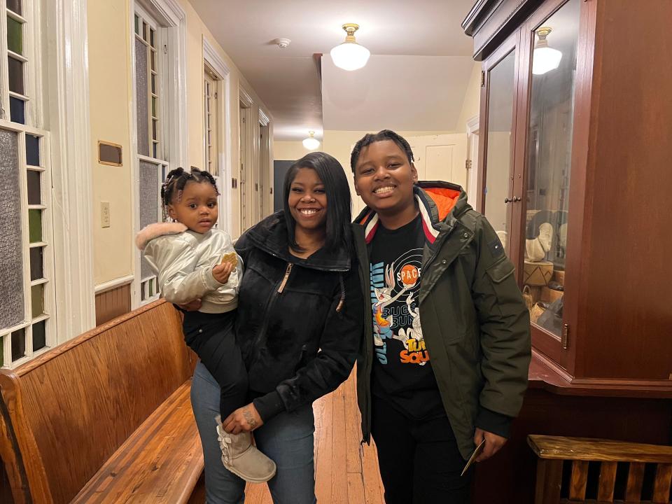 11 year-old hero La'Prentis Doughty (right) smiles with his little sister and mother, Keishana Banks, at the Charles H. Chipman Cultural Center in Salisbury, Md., on Wednesday, December 14, 2022.