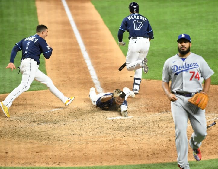 ARLINGTON, TEXAS OCTOBER 24, 2020-Rays Randy Arozarena scores the winning run in front.