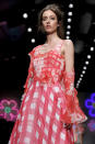 A model wears a design from the Jasper Conran Spring/Summer 2013 collection during London Fashion Week, Saturday, Sept. 15, 2012. (AP Photo/Jonathan Short)