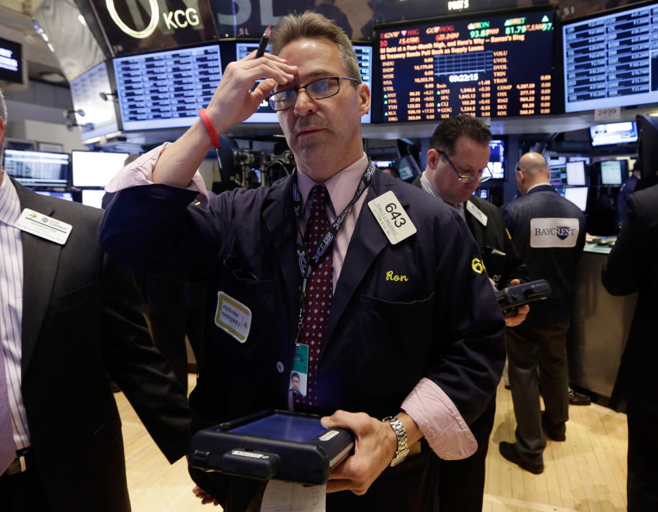 Trader Ronald Madarasz works on the floor of the New York Stock Exchange, Wednesday, Feb. 26, 2014.The stock market is little changed as investors pick over more earnings reports from retailers and other U.S. companies. (AP Photo/Richard Drew)