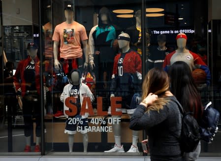 People pass by the NBA Store in New York