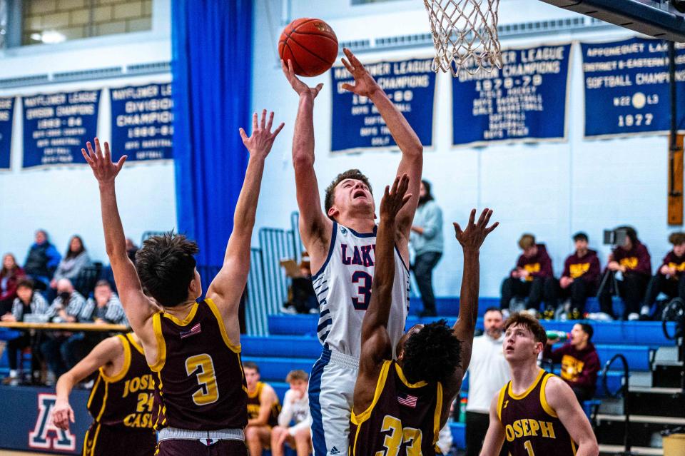 Apponequet's Nathan Levesque powers his way to the basket.