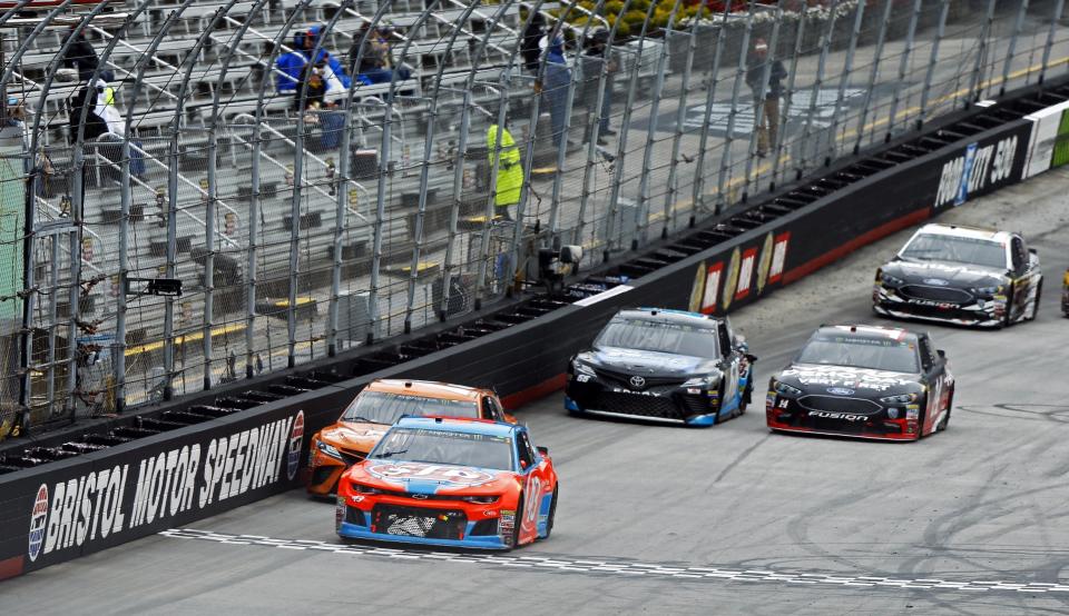 FILE - Bubba Wallace (43) leads Daniel Suarez (19), Clint Bowyer (14), Chad Finchum (66) and Aric Almirola (10) during a NASCAR Cup Series auto race, Monday, April 16, 2018, in Bristol, Tenn. Bristol Motor Speedway will ditch the dirt track concept the Tennessee short track has used the last three years and run both of its 2024 NASCAR weekends on the concrete surface.(AP Photo/Wade Payne, File)