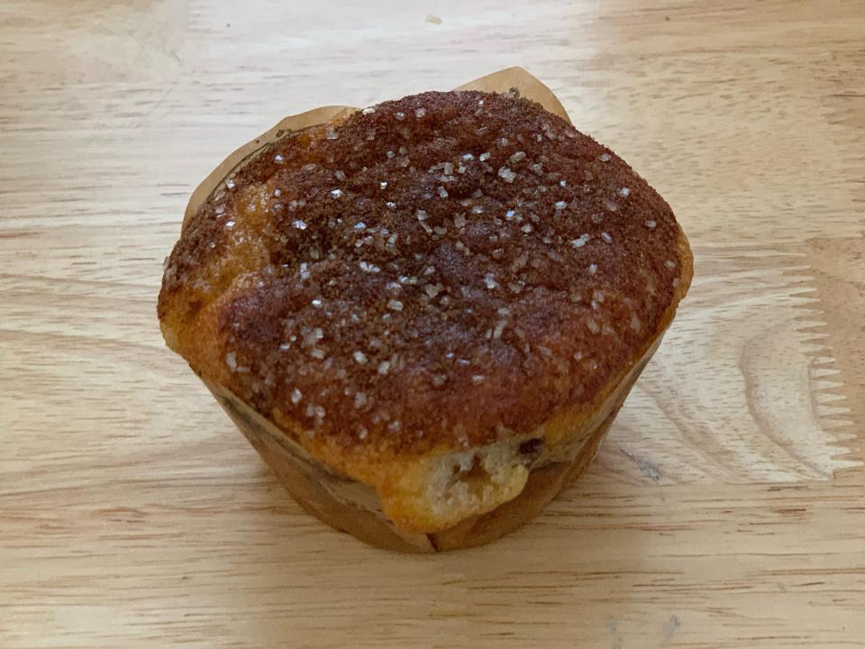 trader joe's coffee cake muffin on wood counter