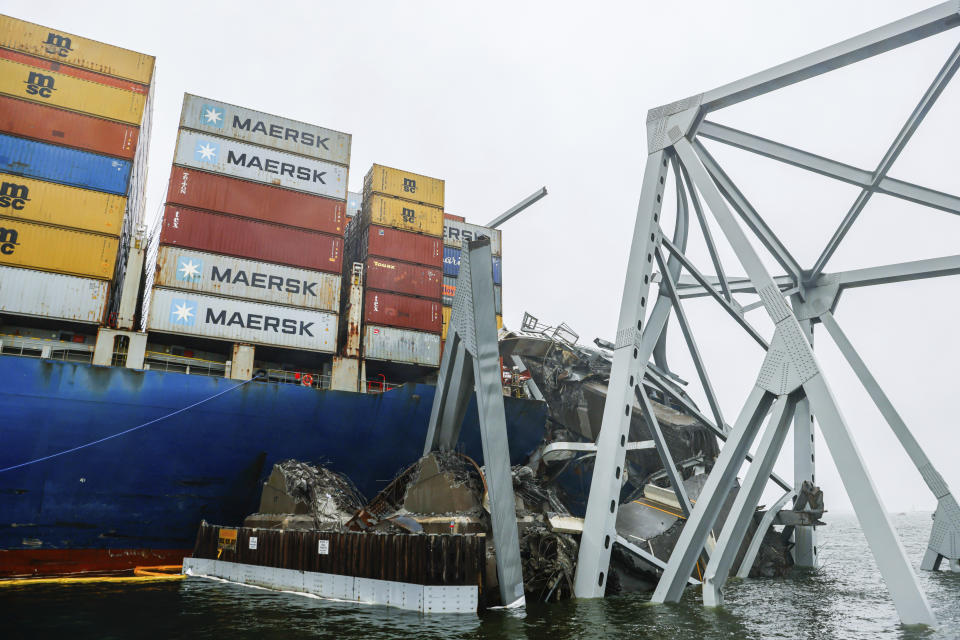 Wreckage of the Francis Scott Key Bridge rests on the container ship Dali, Wednesday, April 3, 2024, in Baltimore. (AP Photo/Julia Nikhinson)