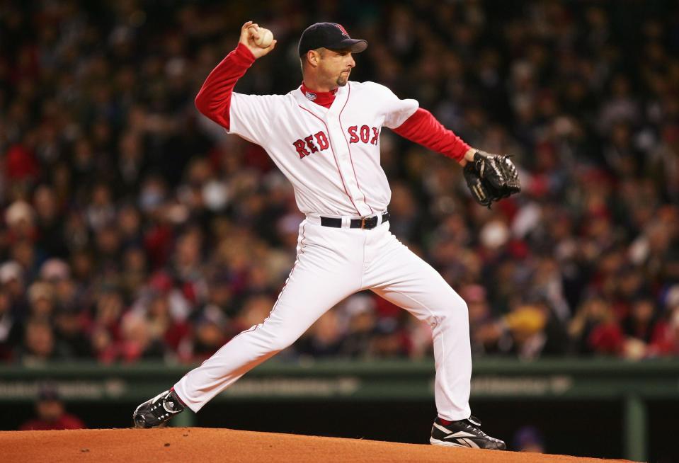 BOSTON - OCTOBER 23:  Pitcher Tim Wakefield #49 of the Boston Red Sox throws a pitch in the first inning against the St. Louis Cardinals during game one of the World Series on October 23, 2004 at Fenway Park in Boston, Massachusetts. (Photo by Jed Jacobsohn/Getty Images)