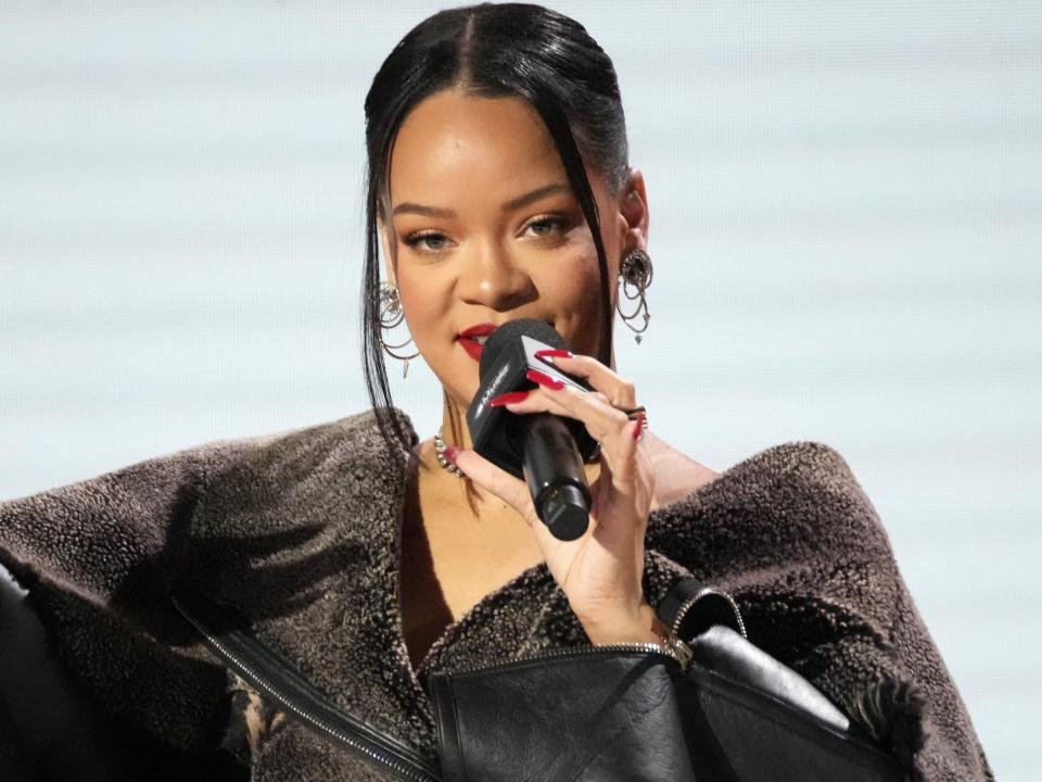 PHOENIX, ARIZONA - FEBRUARY 09: Rihanna speaks onstage during the press conference for Apple Music Super Bowl LVII Halftime Show at Phoenix Convention Center on February 09, 2023 in Phoenix, Arizona.