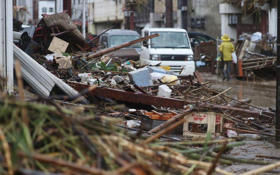 A street covered by Debris in a flood-affected area following torrential rain in Hitoyoshi - STR/AFP