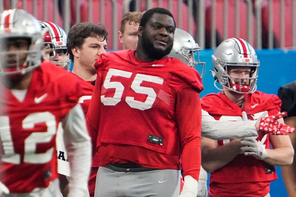 Ohio State Buckeyes offensive lineman Matthew Jones (55) watches from the sideline during a team practice for the Peach Bowl game against the Georgia Bulldogs in the College Football Playoff semifinal at Mercedes Benz Stadium in Atlanta on Dec. 29, 2022.