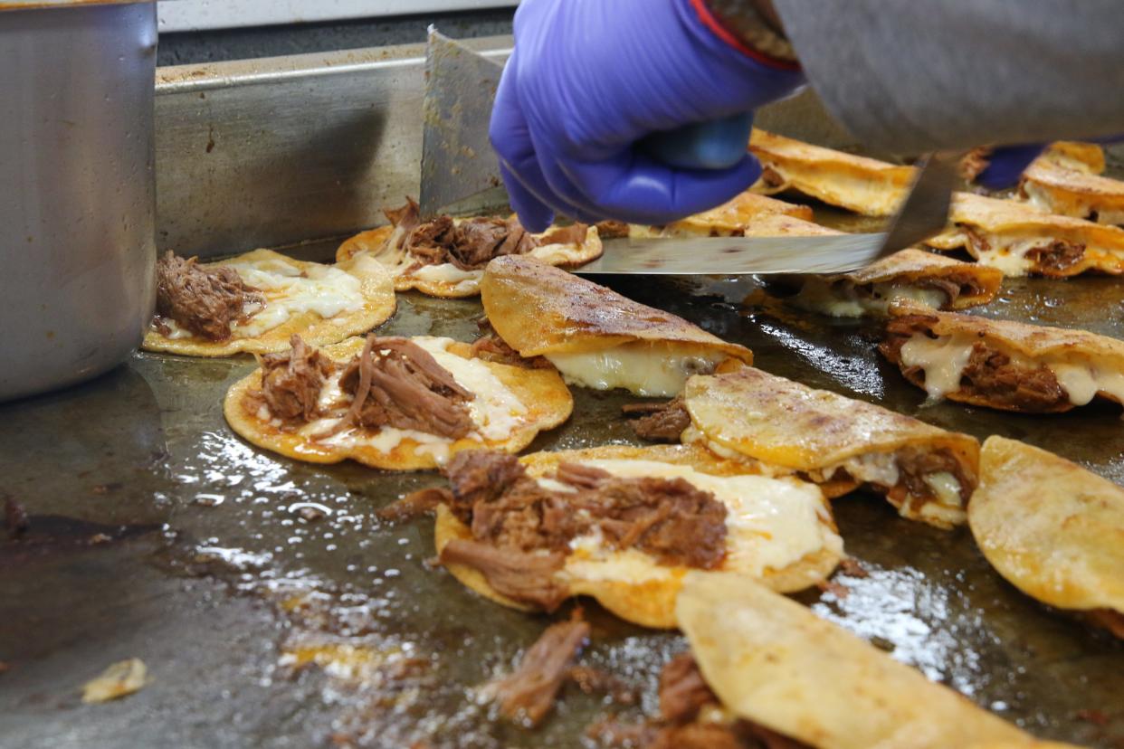 Quesabirrias are grilled on a griddle at El Charro, April 17, 2024 in Carlsbad.