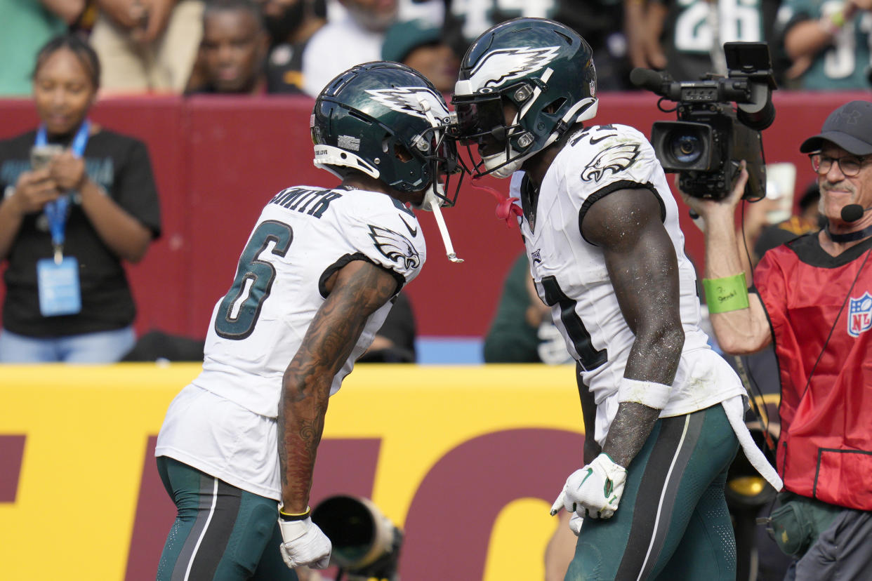 A.J. Brown #11 of the Philadelphia Eagles celebrates a touchdown with DeVonta Smith #6 