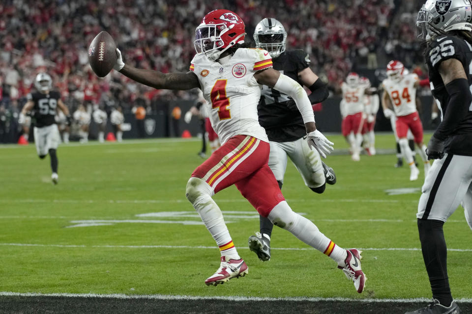 Kansas City Chiefs wide receiver Rashee Rice (4) scores against the Las Vegas Raiders during the second half of an NFL football game, Sunday, Nov. 26, 2023, in Las Vegas. (AP Photo/John Locher)