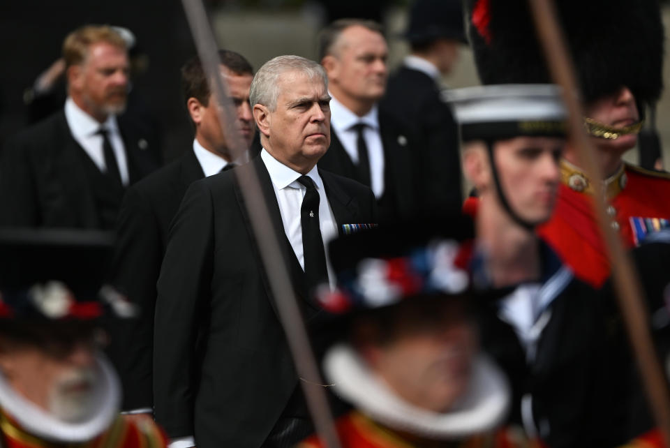 Prince Andrew, Duke of York follows behind The Queen's funeral cortege borne on the State Gun Carriage of the Royal Navy as it leaves Westminster Abbey. (Getty)