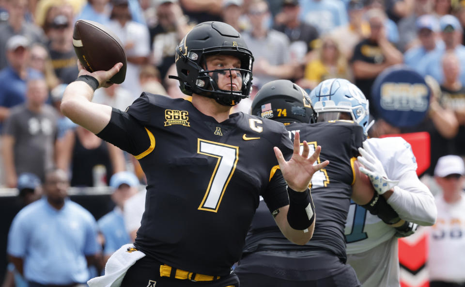 Appalachian State quarterback Chase Brice throws a pass during the first quarter of an NCAA college football game against the North Carolina, Saturday Sept. 3, 2022, in Boone, N.C. (AP Photo/Reinhold Matay)