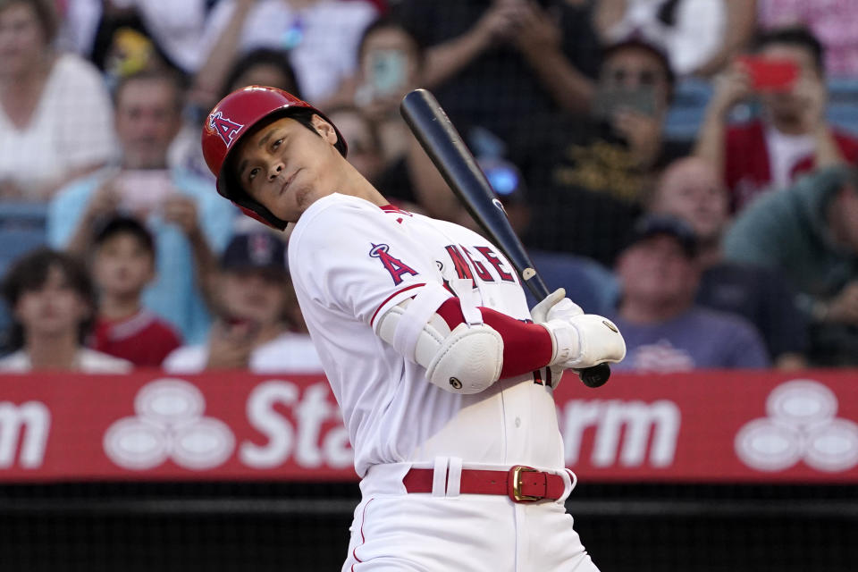 Los Angeles Angels' Shohei Ohtani avoids a close pitch during the first inning of a baseball game against the Seattle Mariners Friday, June 24, 2022, in Anaheim, Calif. (AP Photo/Mark J. Terrill)