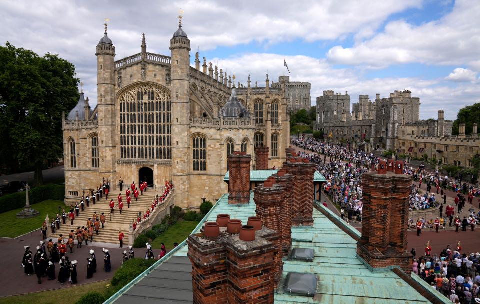 The Order of the Garter procession enters St George's Chapel for the service  on June 13, 2022.